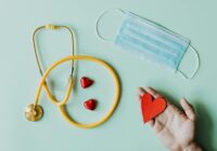 medical stethoscope and mask composed with red foiled chocolate hearts