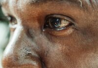 a close up shot of a person crying